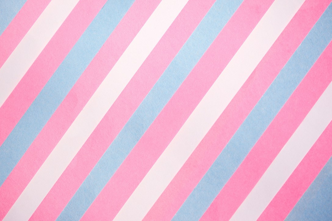 Pink, blue and white diagonal stripes, in the manner of the trans flag.